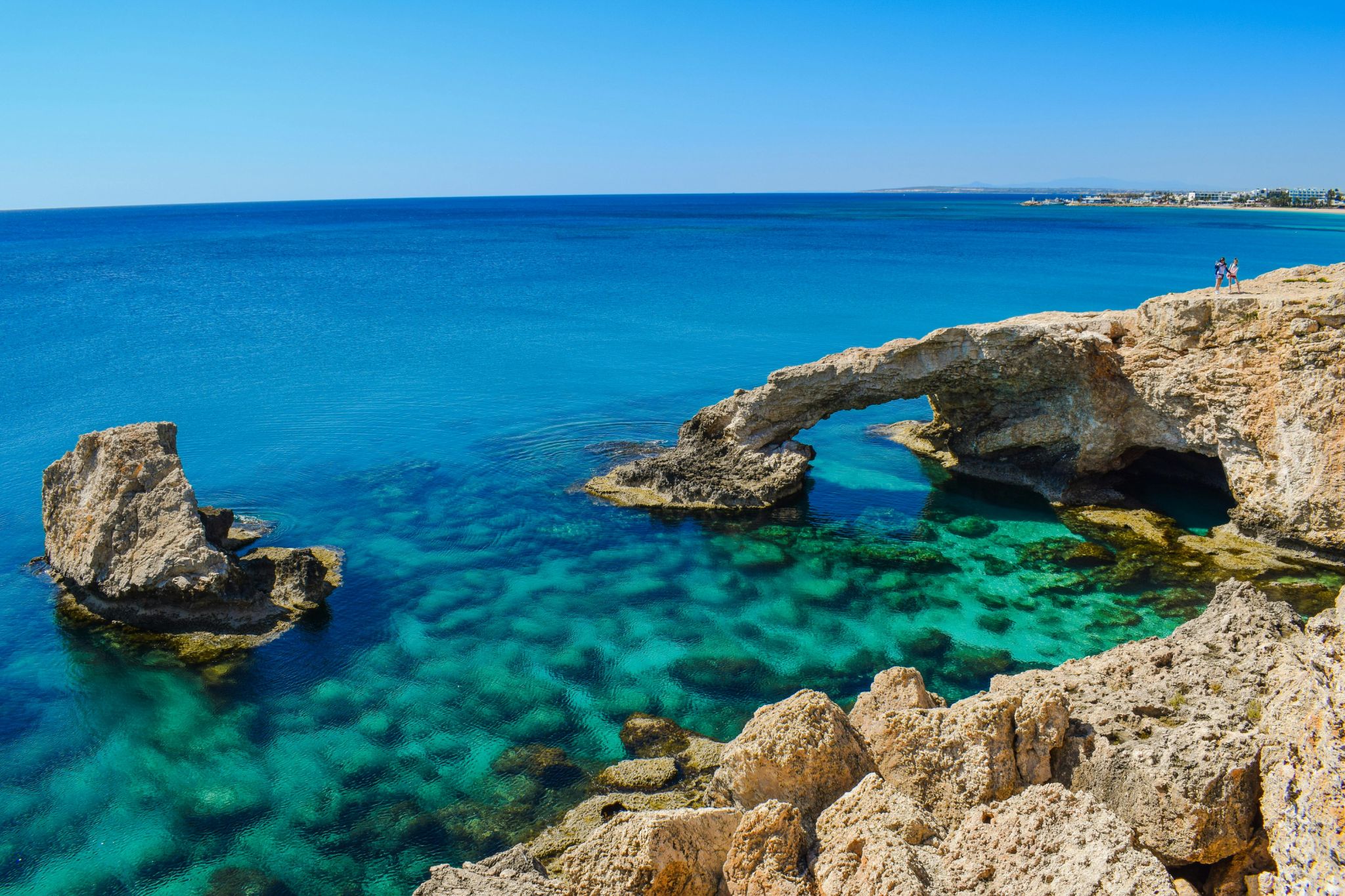 Cyprus passport and Mediterranean coast representing EU citizenship benefits
